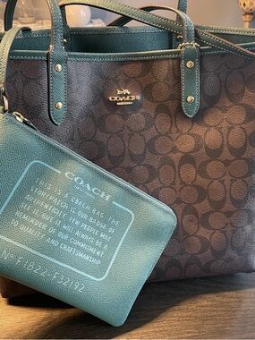 Coach Classic Brown Signature Canvas ReversibleTote with Teal Wristlet.